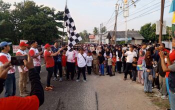 Mulkan Angkat Bendera Start Peserta Jalan Santai Bergerak